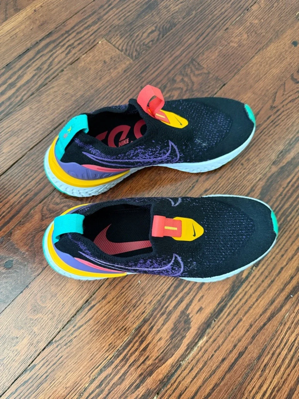 Nike Women's Black Athletic Slip-On Shoes with Purple, Teal & Yellow Accents